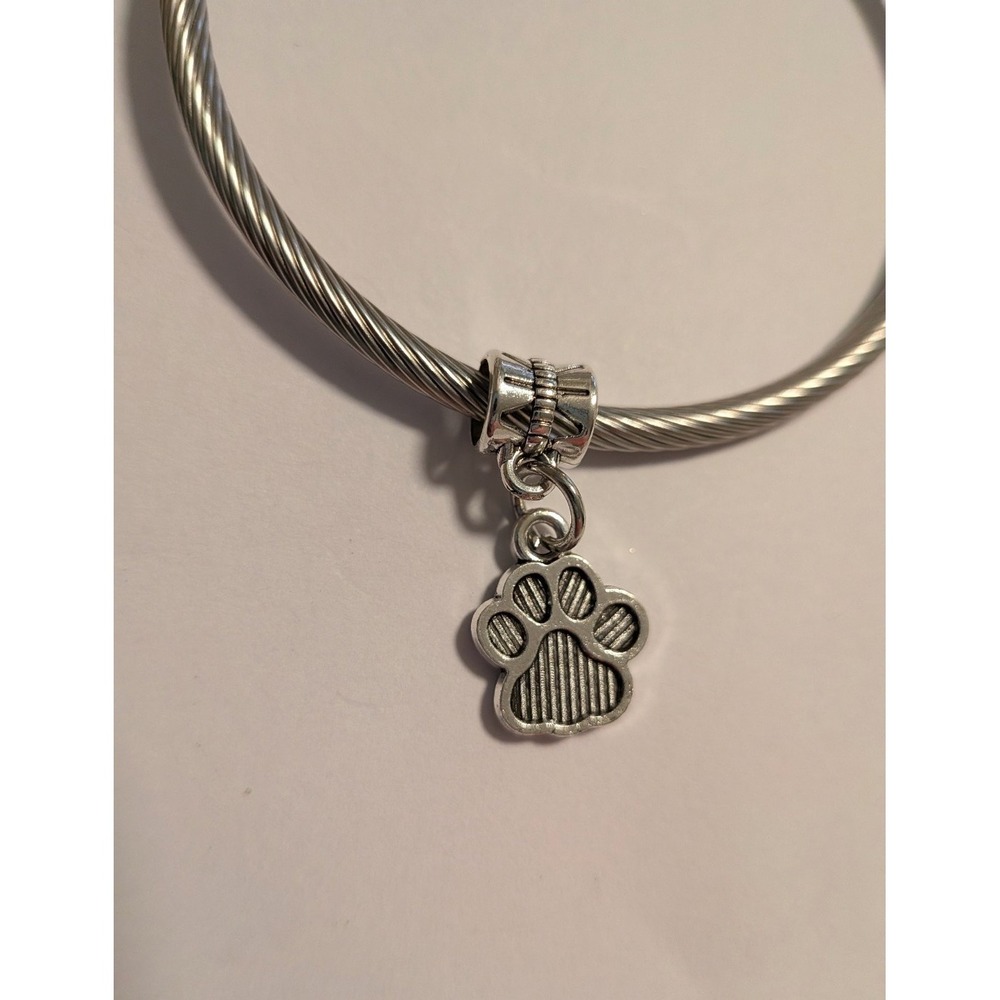 Silver Tone Cable Wire Bangle Bracelet with Textured Paw Print Dangle Charm